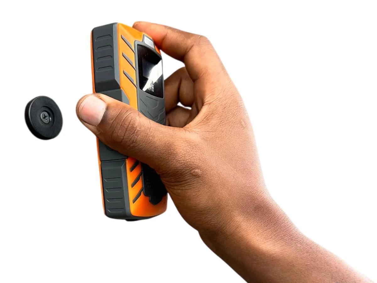 The reader held up to a black RFID checkpoint tag